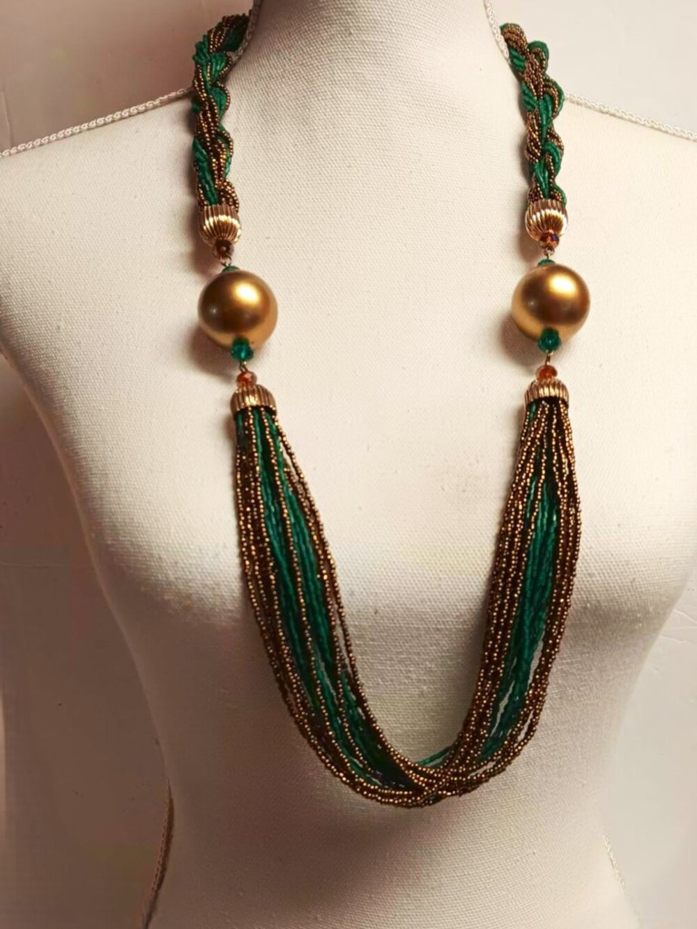 Necklace, beaded, statement, gold, teal and copper seed beads. 32", 20 strand.